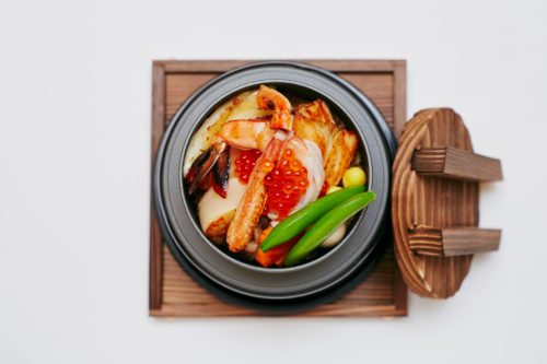 Japanese-style risotto in traditional rice pot